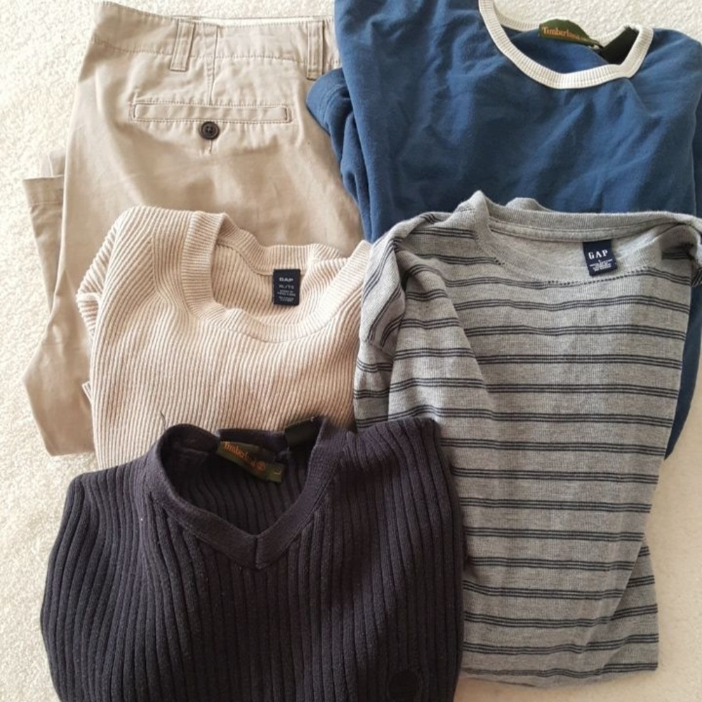 Lot of men sweaters and long sleeve shirts.